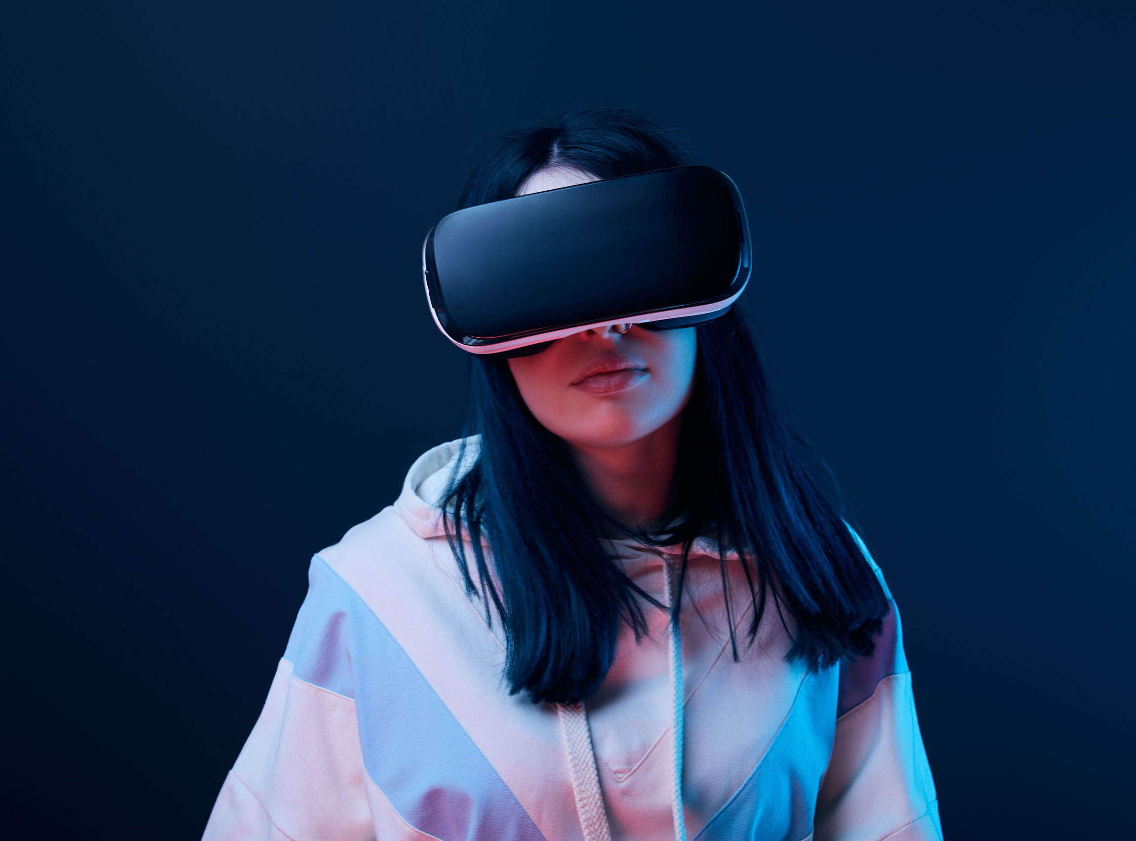 brunette-young-woman-using-virtual-reality-headset-2022-01-18-23-39-00-utc.jpg